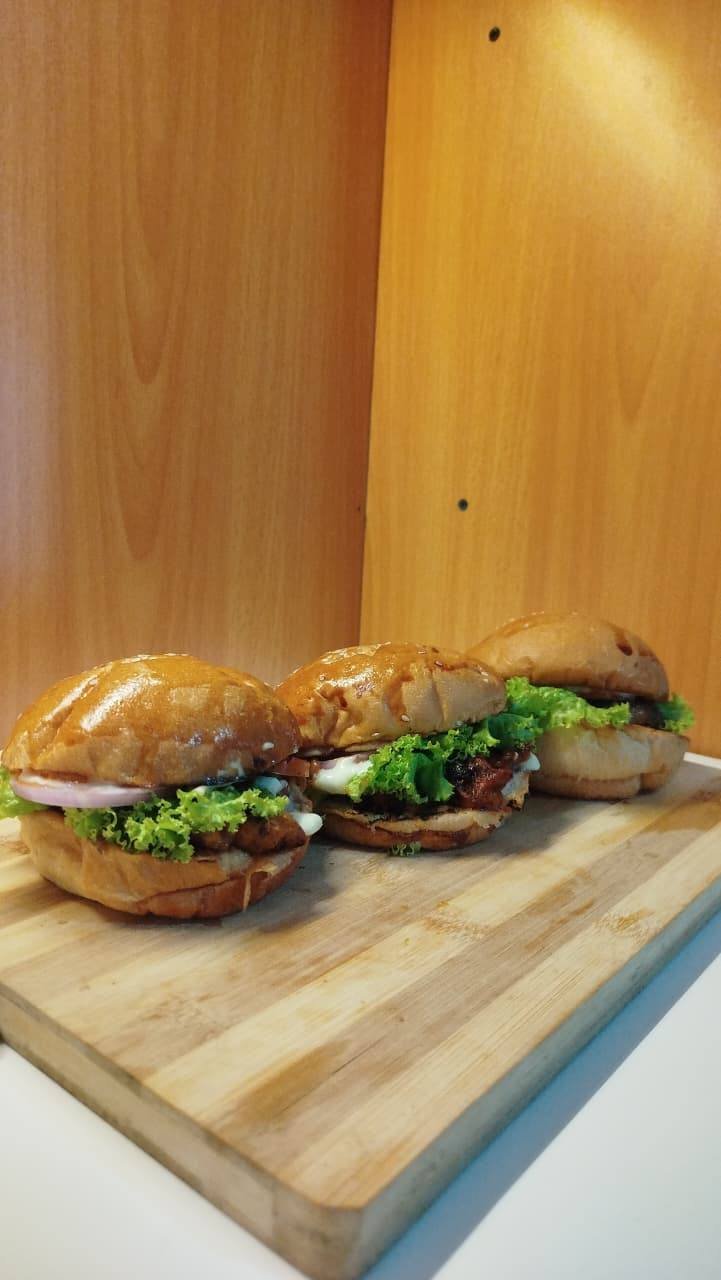 Burgers on a wooden board